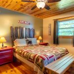 First bedroom in Sam's Island cabin, shows queen bed and bedside tables