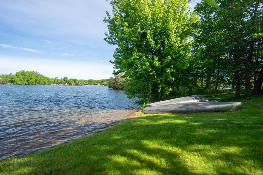 outside image of beach and kayak area of island cabin